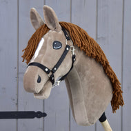 The Hobby Horse LarDen "Oliver" features brown fur, a white blaze, yarn mane, and comes with a black halter plus a free fur halter. It's modeled after an Oldenburg stallion and mounted on a wooden stick.