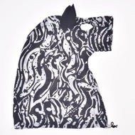 The Hobby Horse LarDen Hobby Horse protective suit Black & White is a black and white patterned garment designed to resemble a horse’s head, complete with an ear, eye hole, and abstract zebra-like stripes—ideal for protecting your hobby horse.