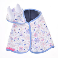 The Set Vanessa NEW by Hobby Horse LarDen features a baby cape and matching hat with white horn-like details and a pastel floral pattern with blue trim—ideal as a whimsical blanket set or playful ear bonnet for little ones.
